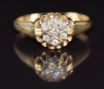 An 18ct gold ring set with diamonds in a cluster, Birmingham 1916, 2.6g, size O
