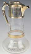 Victorian hallmarked silver mounted claret jug with coat of arms to both lid and glass body 'Je
