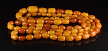 Baltic amber necklace made up of 95 graduated oval beads, 47g, 108cm, largest bead 19.3 x 13.4mm,