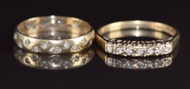 A 9ct gold ring set with diamonds in a setting reading 'Eternity' and a 9ct gold eternity ring set