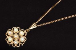 A 9ct gold pendant set with pearls, on 9ct gold chain, 3g, pendant 1.5cm, chain 42cm long