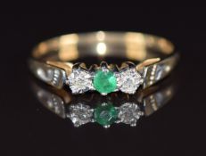 A 9ct gold ring set with an emerald and diamonds, 1.5g, size P
