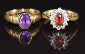 Two 9ct gold rings, one set with an oval cut amethyst the other a garnet, 3.8g, size J