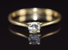 An 18ct gold ring set with a round cut diamond of approximately 0.25ct, 1.9g, size N