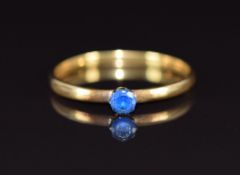 A 22ct gold wedding band set with synthetic spinel, 1.8g, size Q