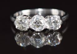 A platinum ring set with three old cut diamonds of approximately 0.73ct, 0.55ct and 0.58ct, 4g, size