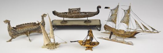 Five silver novelty models of boats including a filigree Venetian gondola and a Viking longship