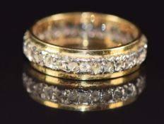 An 18ct gold eternity ring set with spinel, 3.5g, size J