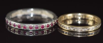 A 9ct white gold eternity ring set with rubies (2.3g, size T) and a 9ct gold eternity ring set