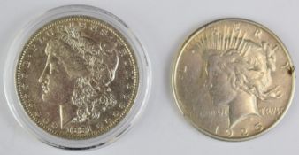 1881 Morgan USA dollar together with a 1925 Liberty dollar, one with certificate