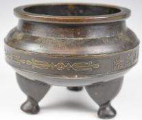 Chinese bronze tripod censer decorated with script and with four character mark to base, diameter 14