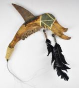 Native American Indian saw bone knife or club with feather decoration, length 40cm