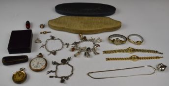 A collection of jewellery including two silver charm bracelets with charms including 10 Shilling