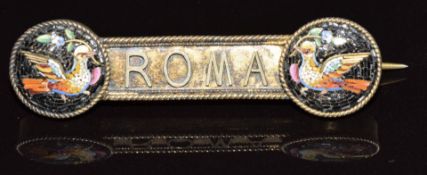 A silver gilt brooch reading 'Roma' set with two micro mosaic plaques depicting doves, 6.2g, 4.5cm