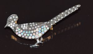 A silver brooch in the form of a pheasant, set with opals and diamonds