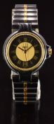 Dunhill Millennium wristwatch with date aperture, gold hands and Roman numerals, gold and black