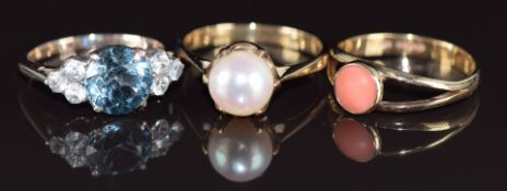 Two 9ct gold rings, one set with a pearl the other with coral (3.6g, size K) together with a