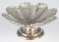 Victorian hallmarked silver bon bon dish, on lobed form with embossed decoration, raised on a single