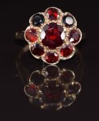 A 9ct gold ring set with a cluster of garnets, 3.8g, size M