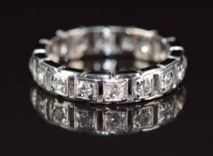 An 18ct white gold eternity ring set with 16 diamonds, each approximately 0.04ct, 5.3g, size L