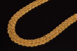 A 22ct gold necklace made up of plaited faceted beads c1960s, 59.8g