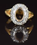 An 18ct gold ring mount set with twelve diamonds, each approximately 0.04ct, 7.3g, size L
