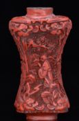 19th / 20thC Chinese carved cinnabar snuff bottle with figural decoration, height 8cm
