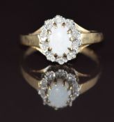 A 9ct gold ring set with an opal cabochon and diamonds, 1.7g, size J/K