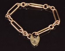 A 15ct rose gold bracelet made from a watch chain, with heart padlock clasp, 18cm long, 17.4g