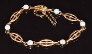 A c1910 9ct rose gold bracelet set with opal cabochons, 11.3g, 16cm long