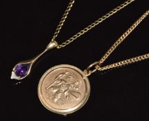 A 9ct gold pendant set with an amethyst and diamond and a 9ct gold St Christopher, both on 9ct