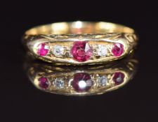 A c1900 18ct gold ring set with rubies and diamonds, 3.2g, size M