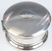 George V hallmarked silver dressing table or jewellery pot with engine turned Art Deco style lid,