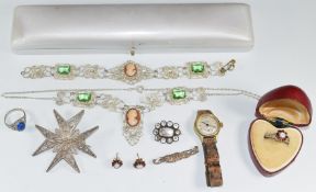 A silver filigree brooch, silver filigree necklace set with cameos, Georgian mourning brooch set