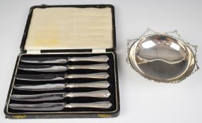 Silver bonbon dish, with decorative border, raised on three feet, marked 900, diameter 14.5cm,