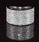 A 9ct white gold ring set with seven rows of diamonds, 7.4g, size M