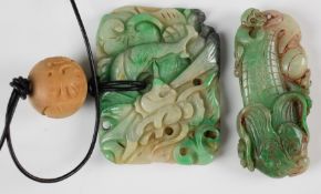Two Chinese carved jadeite pendants, one depicting a monkey on corn (7cm long) the other a dragon (