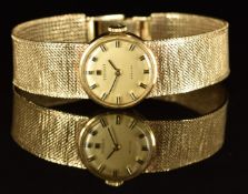 Tissot Stylist 9ct gold ladies wristwatch with black hands, two-tone hour markers, gold dial and
