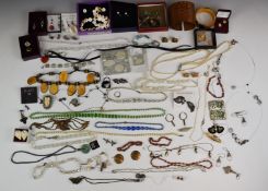 A collection of costume and vintage jewellery including earrings, shell necklace and earrings,
