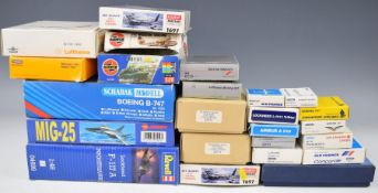 A collection of over twenty aviation diecast and plastic model kits to include Boeing B-747, MIG