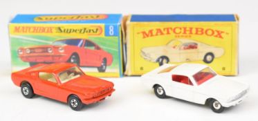 Two Matchbox Ford Mustang diecast model cars in red and white, both in boxes, one being