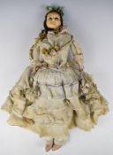 Early Victorian wax on composition doll in bridal dress with stuffed body, black fixed glass eyes,
