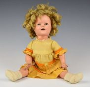 Ideal composite Shirley Temple doll with weighted eyes, open mouth, jointed limbs and yellow