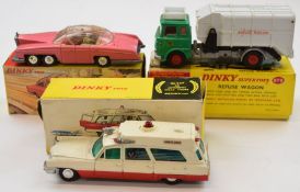 Three Dinky Toys diecast model cars comprising Superior Cadillac Ambulance 267, Lady Penelopes FAB 1