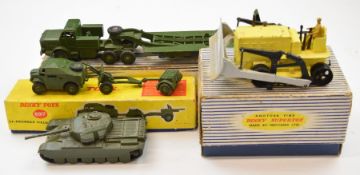 Four Dinky Supertoys diecast models comprising Tank Transporter 660, 25 Pounder Field Gun Set 697,