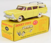 Dinky Toys diecast model Rambler Cross Country Station Wagon with yellow body, white roof and red