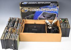 Sega Saturn retro video game console in original box with controller, power supply and 22 games to