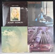 Approximately 30 albums including The Beatles, Joni Mitchell, Simon and Garfunkel, Paul McCartney