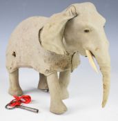 Early 20th century clockwork elephant likely by Roullet & Decamps, with textured hide, glass eyes