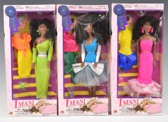 Three Imani 'African American Princess' fashion dolls in original boxes with accessories.